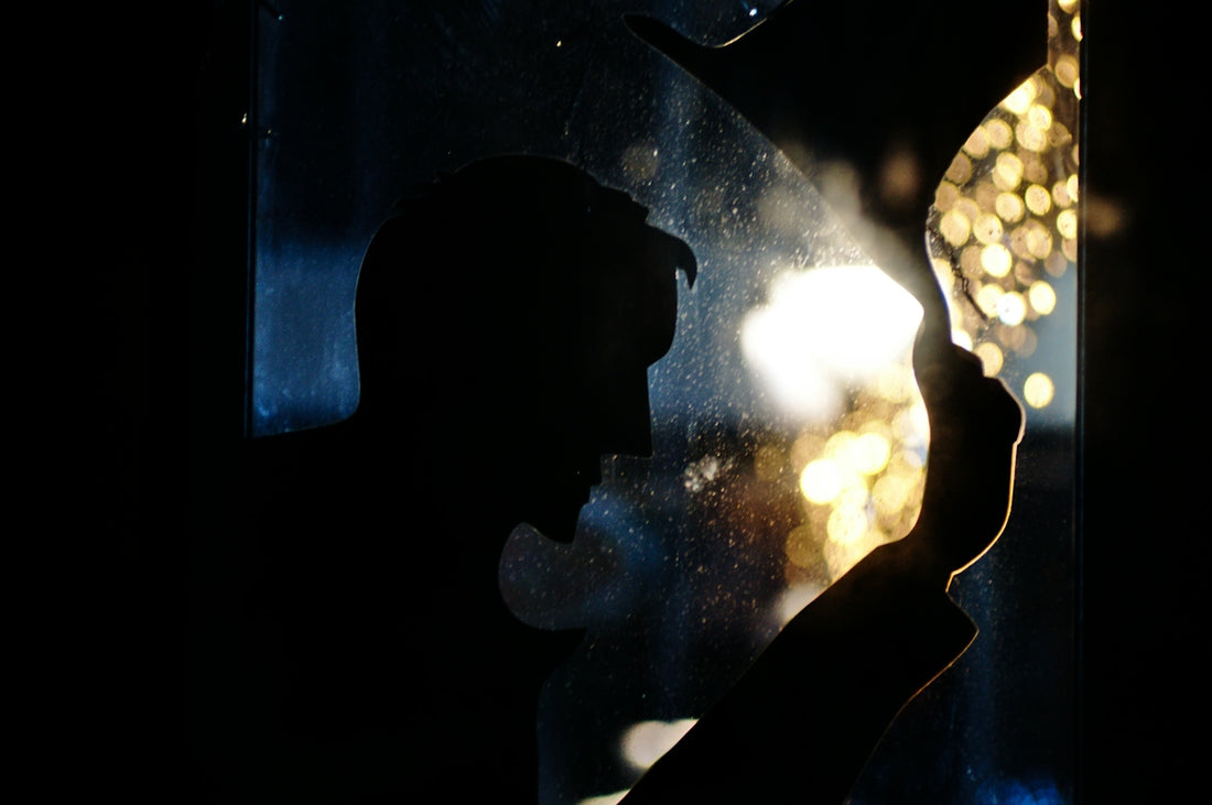 silhouette of man with bokeh background