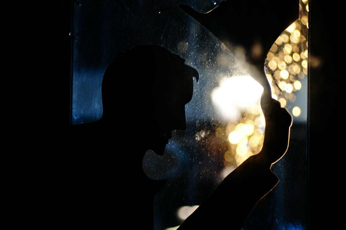 silhouette of man with bokeh background