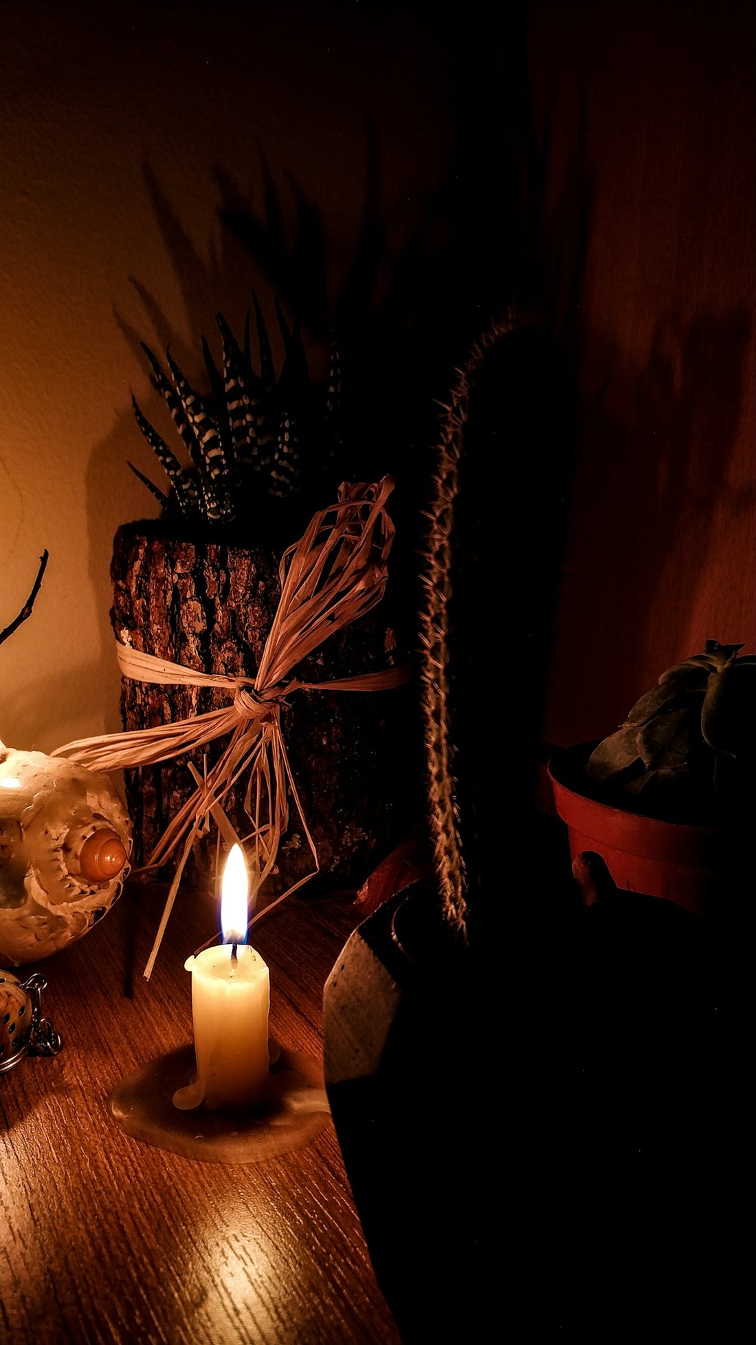 lighted candle on brown wooden table