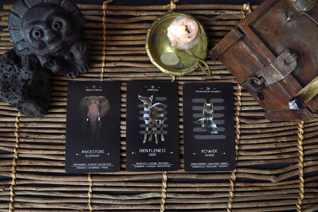 a wicker basket with three cards and a candle