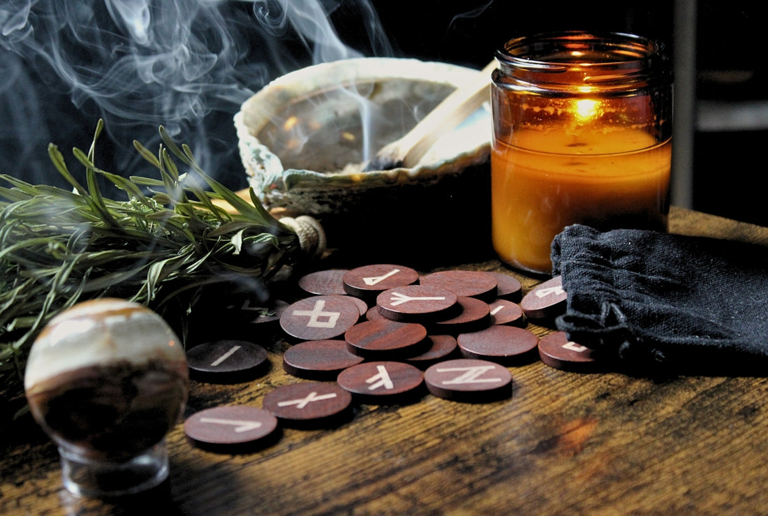a table with a jar of liquid and a candle on it