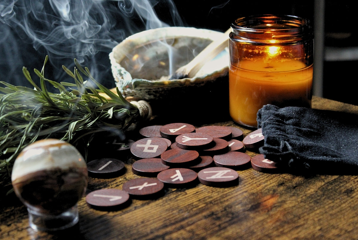 a table with a jar of liquid and a candle on it
