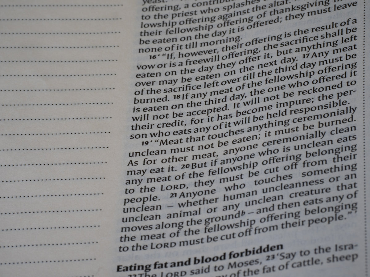 Close-up of text in a book with lines