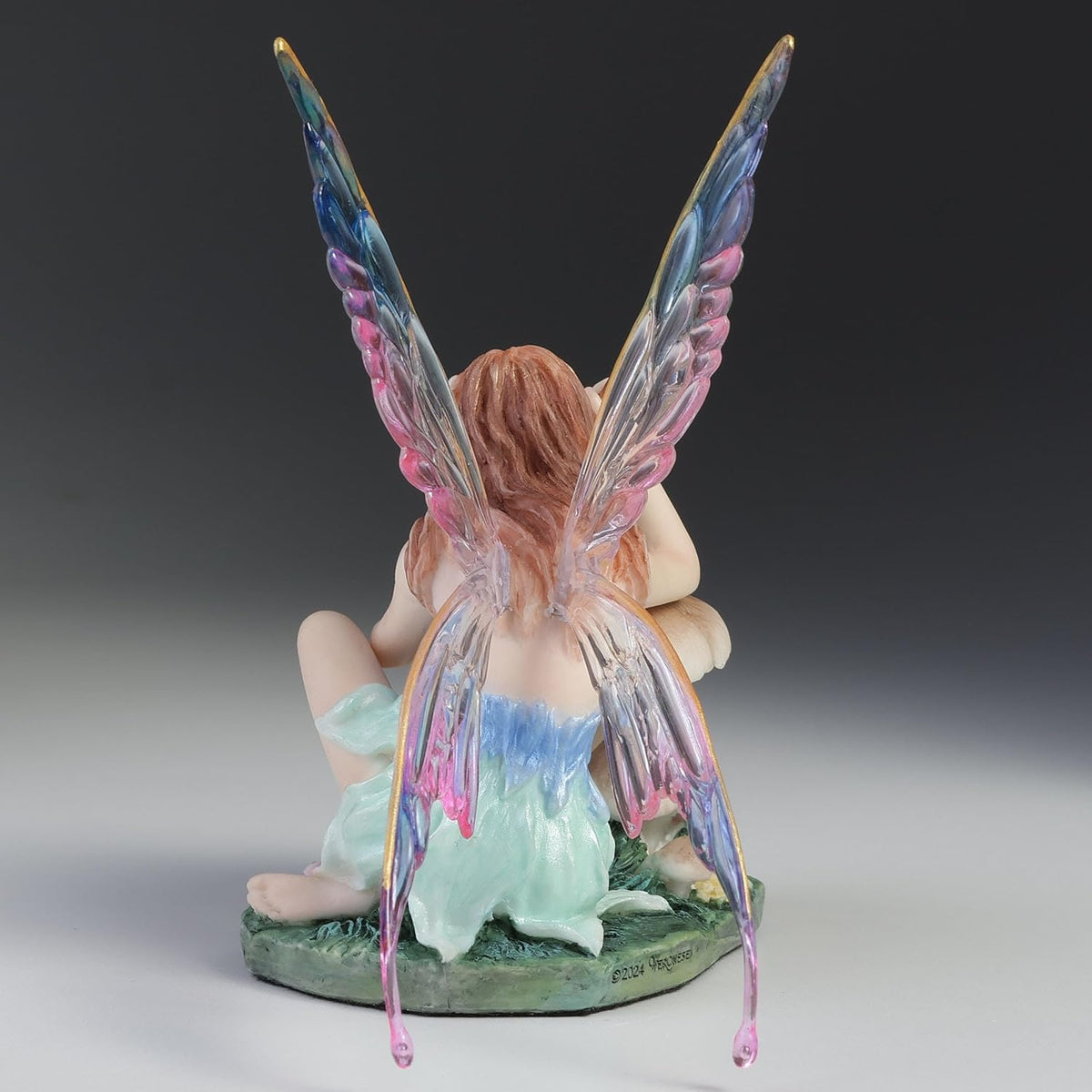 Chromatic Fairy Painting a Lady Bug Figurine