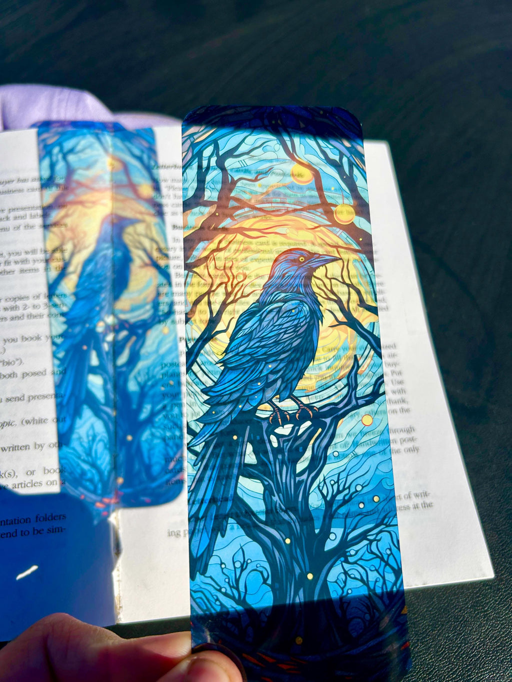 Gothic raven bookmark with stained glass arch, sunset skies and vintage pedestal, dark fantasy bird art for moody readers | | Wiccan Center