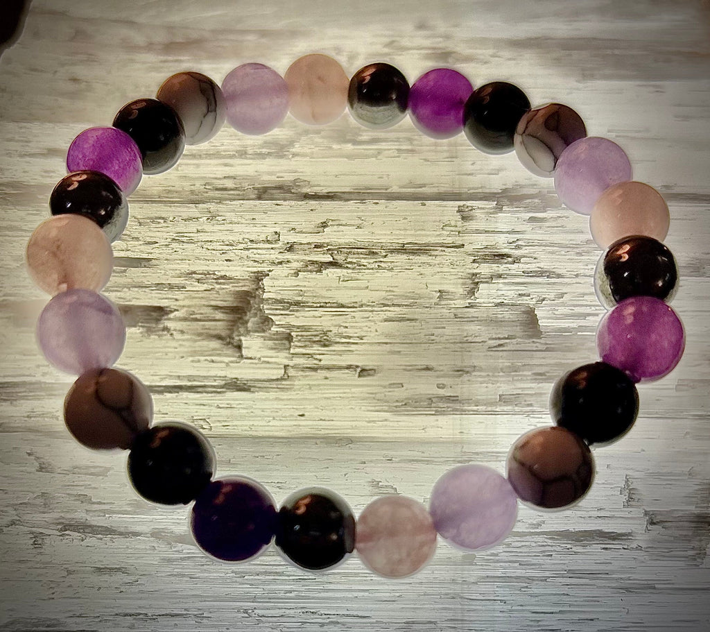 The Empaths Recharge Bracelet (amethyst, Clear Quartz, Rose Quartz, White Howlite, Black Tourmaline) | | Wiccan Center