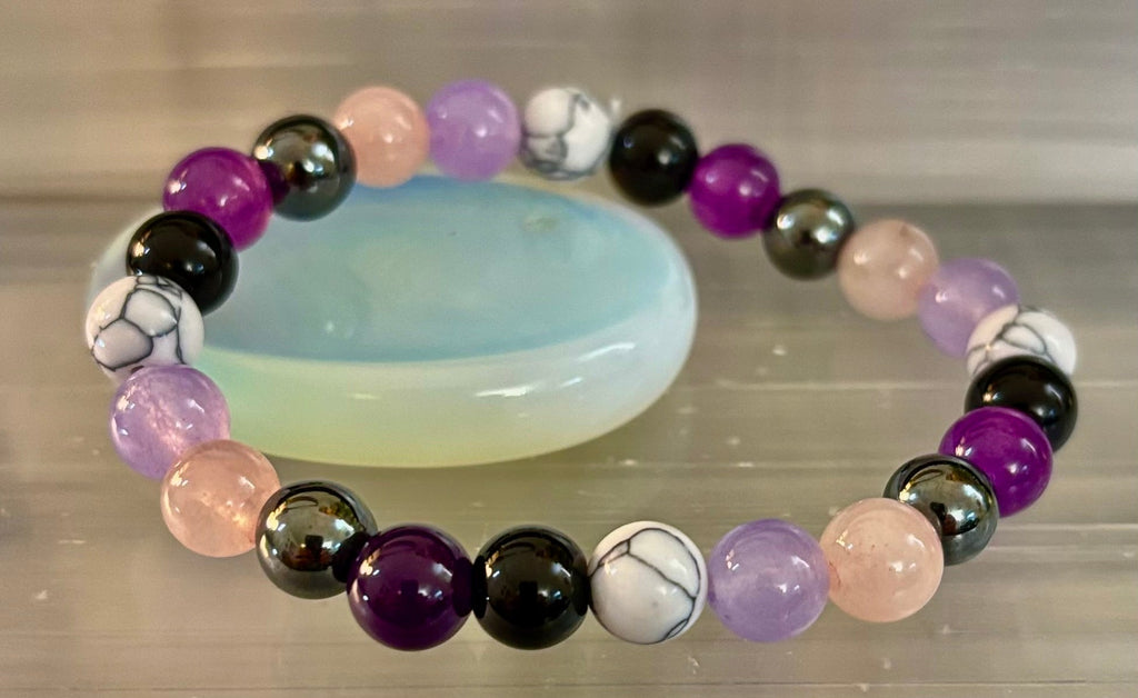 The Empaths Recharge Bracelet (amethyst, Clear Quartz, Rose Quartz, White Howlite, Black Tourmaline) | | Wiccan Center