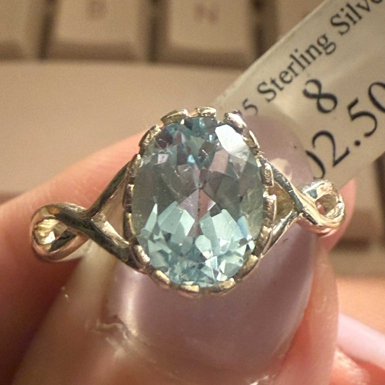Sterling Silver Oval Blue Topaz Ring with Infinity Twist Band (Size 8) | Rings | Wiccan Center