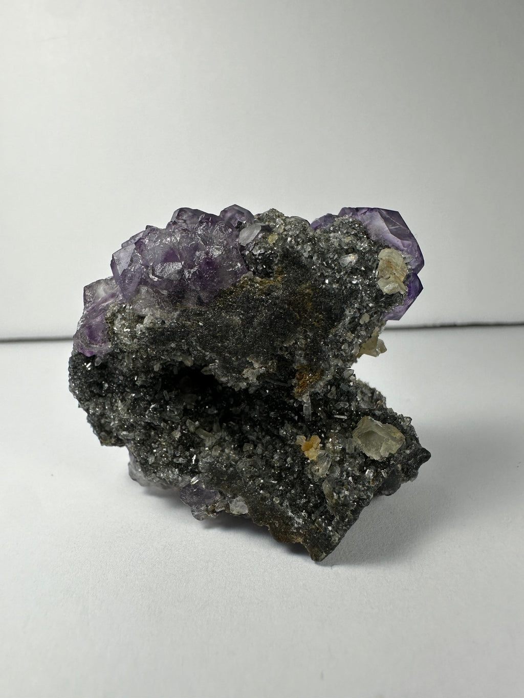 Purple Dodecahedral Fluorite with Calcite on matrix | Minerals | Wiccan Center