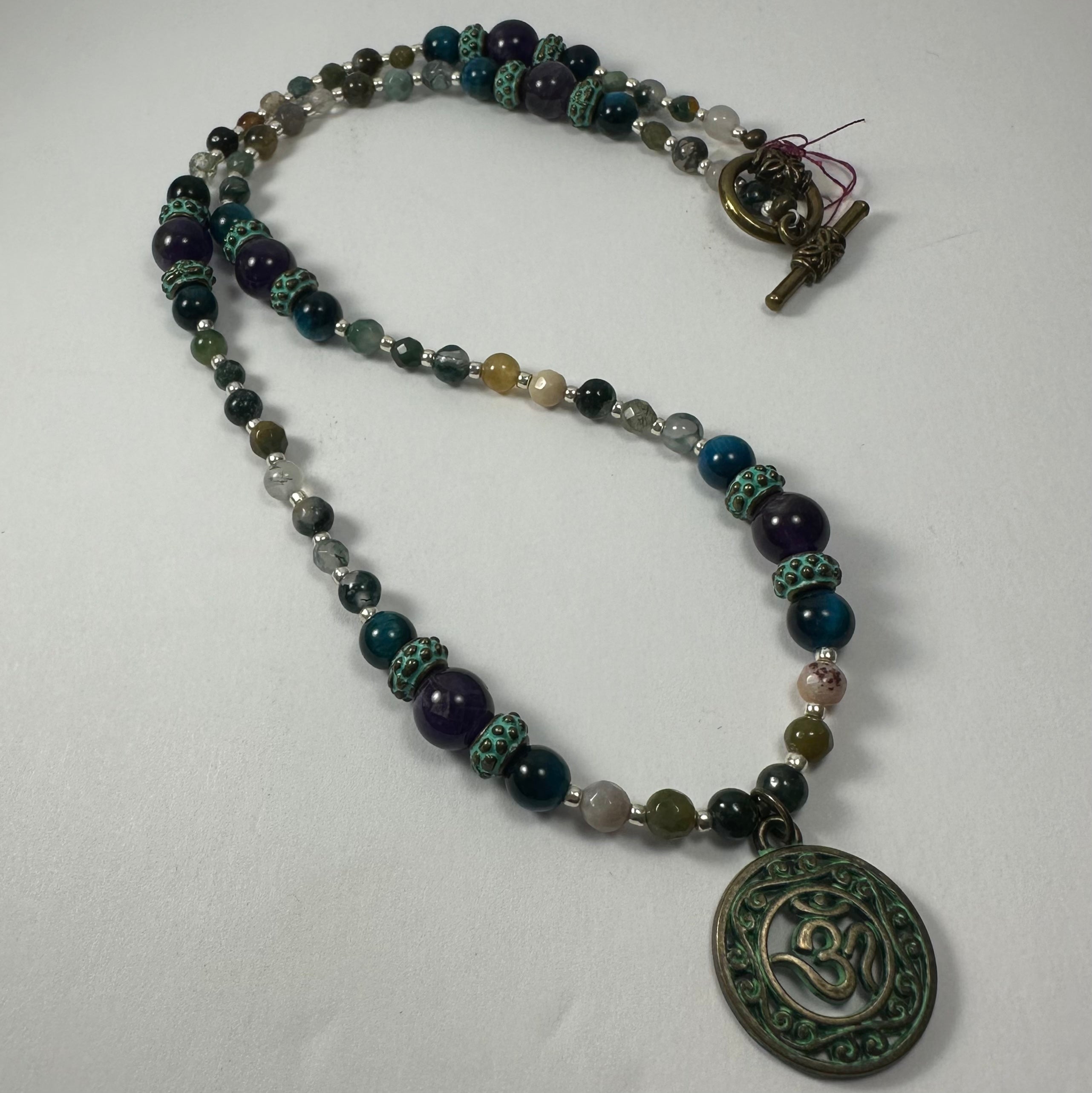 Bronze Patina 'Om' Pendant on Mixed Bead Necklace | Jewelry | Wiccan Center