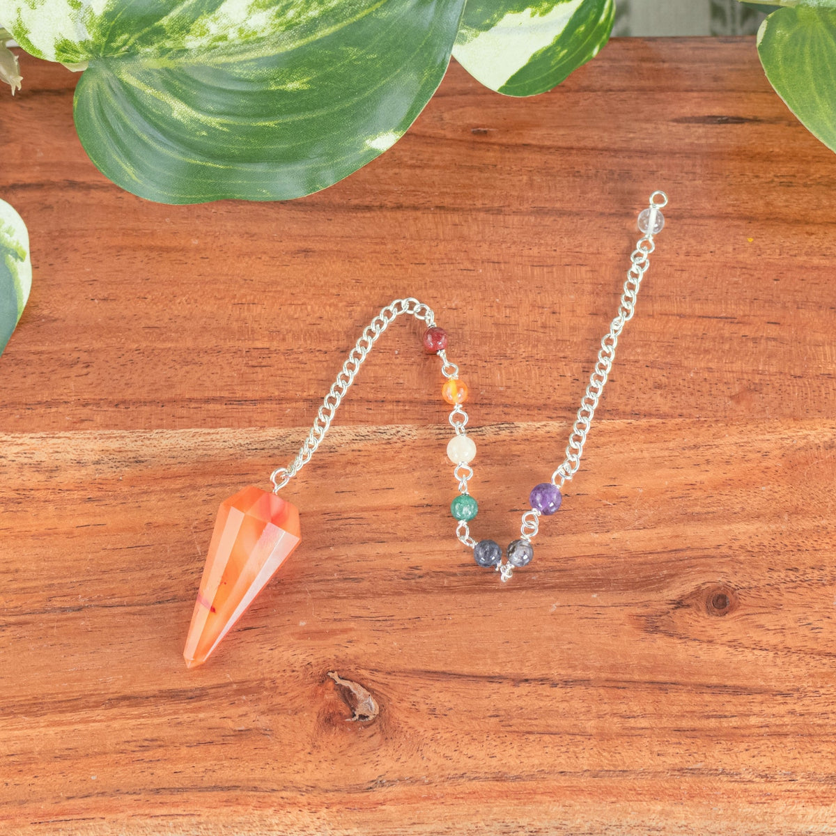 7 Chakra Faceted Carnelian Pendulum | | Wiccan Center
