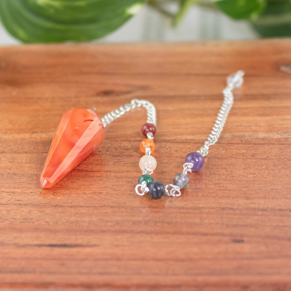 7 Chakra Faceted Carnelian Pendulum | | Wiccan Center