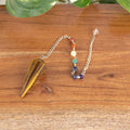 7 Chakra Faceted Tiger's Eye Pendulum | | Wiccan Center