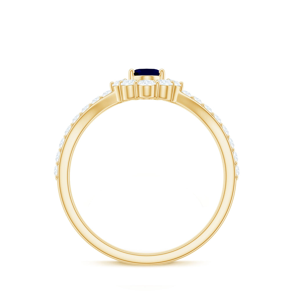 0.6 Carat Oval Cut Blue Sapphire and Diamond Chevron Ring