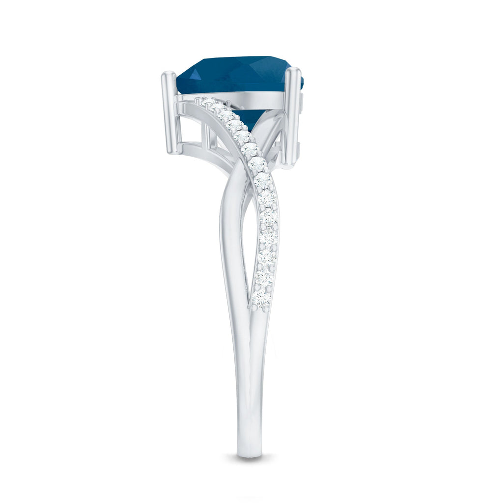 London Blue Topaz and Diamond Heart Engagement Ring in Crossover Band