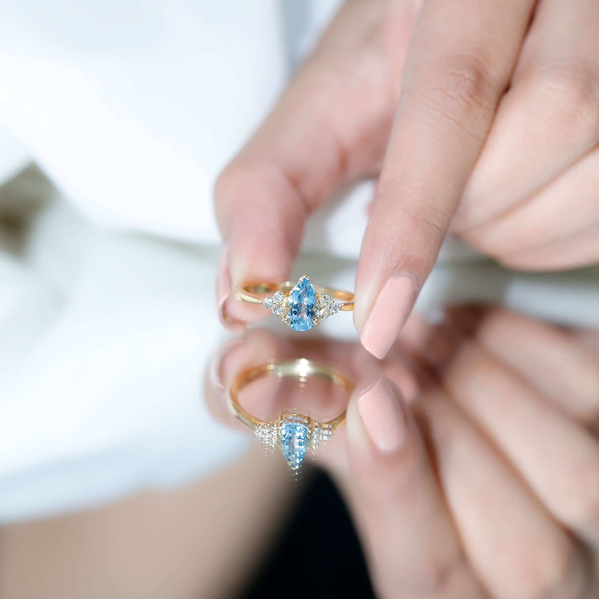 1 Carat Aquamarine Pear Engagement Ring with Diamond Trio