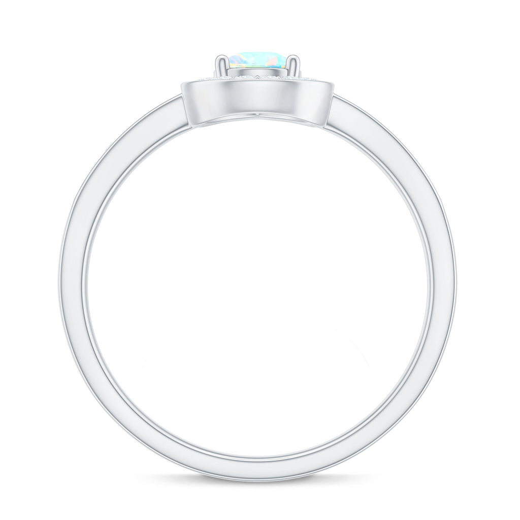 Natural 0.7 Carat Opalescent Teardrop Engagement Ring with Diamond Halo