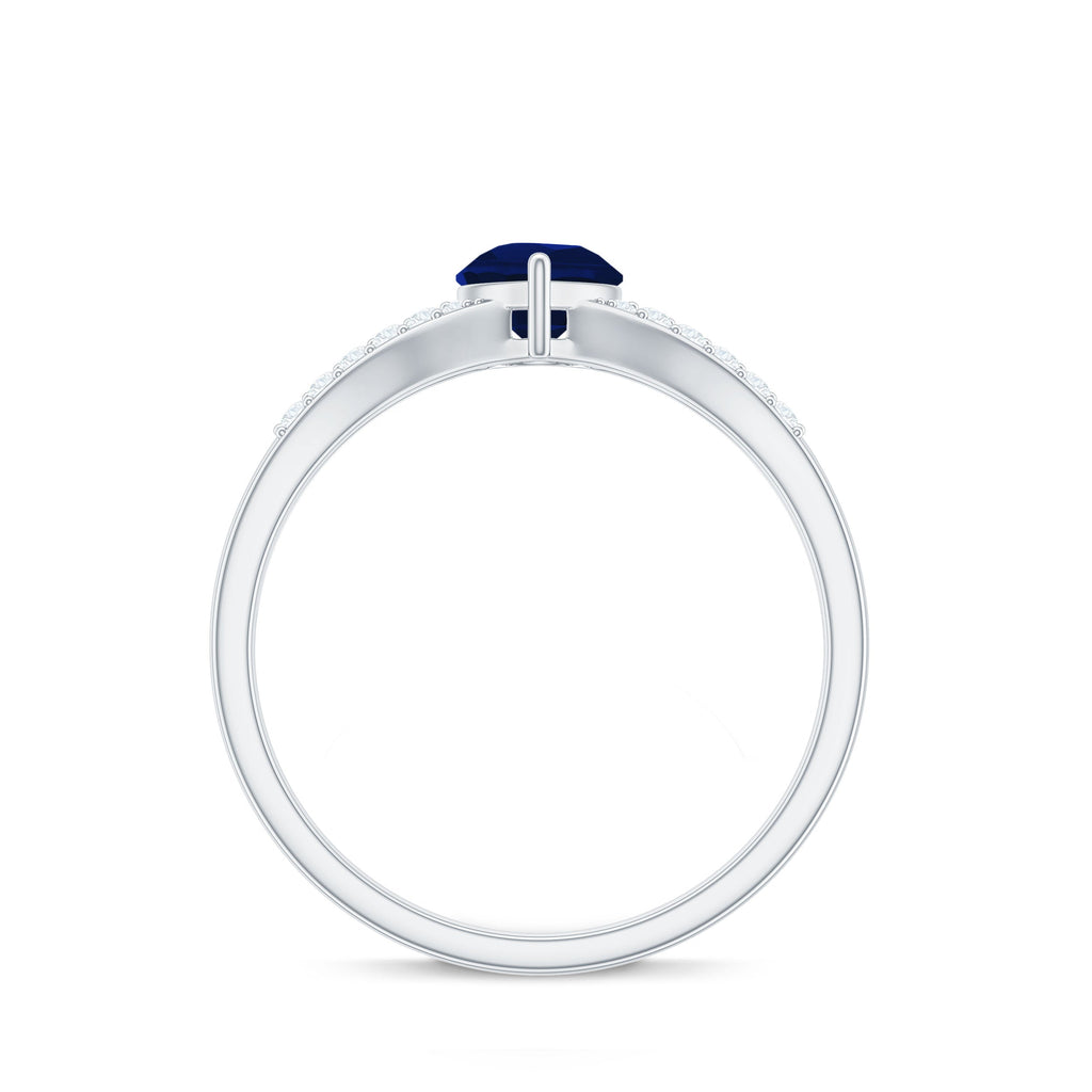 Pear Cut Solitaire Blue Sapphire Split Shank Ring with Diamond