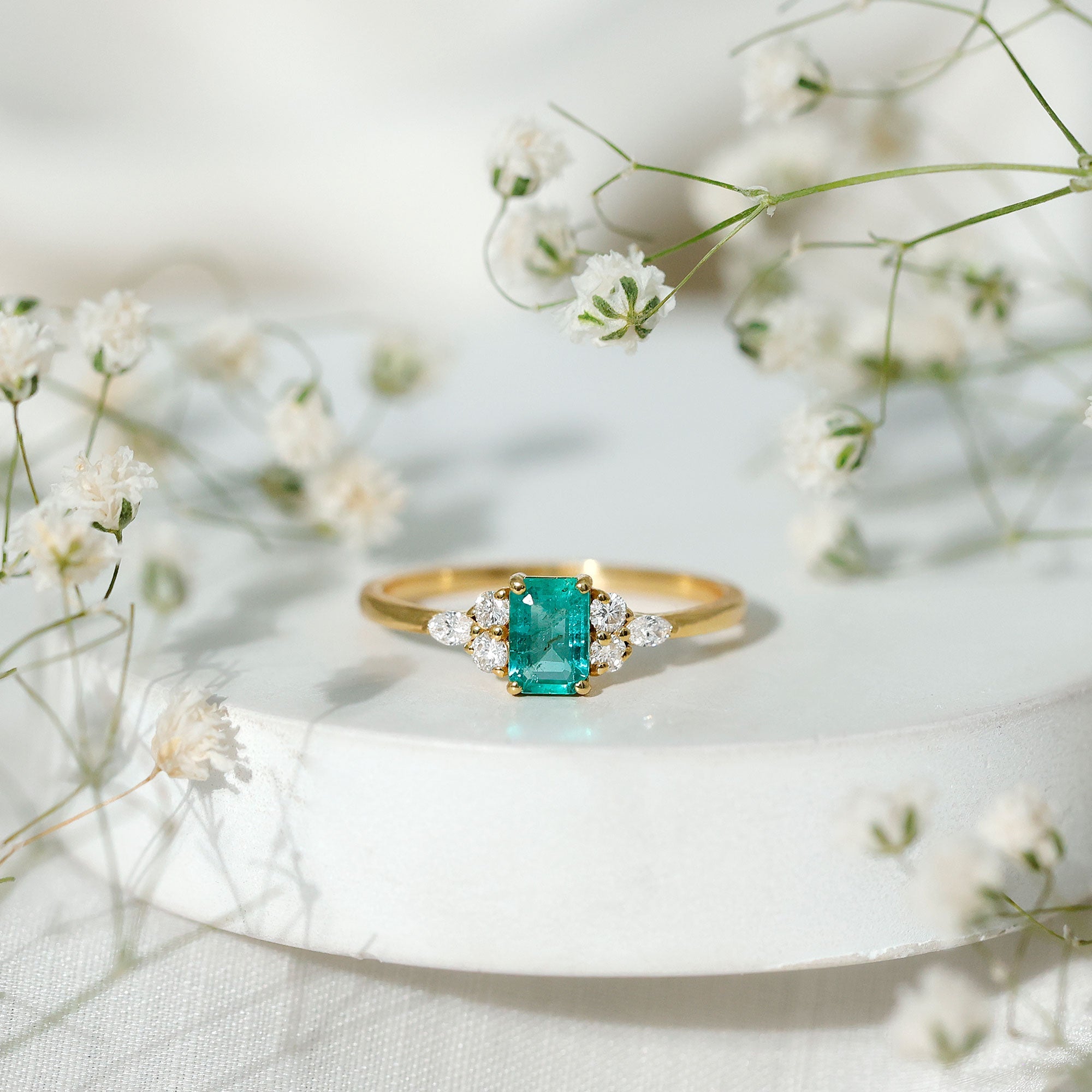 Emerald Cut Emerald Engagement Ring with Diamond Trio