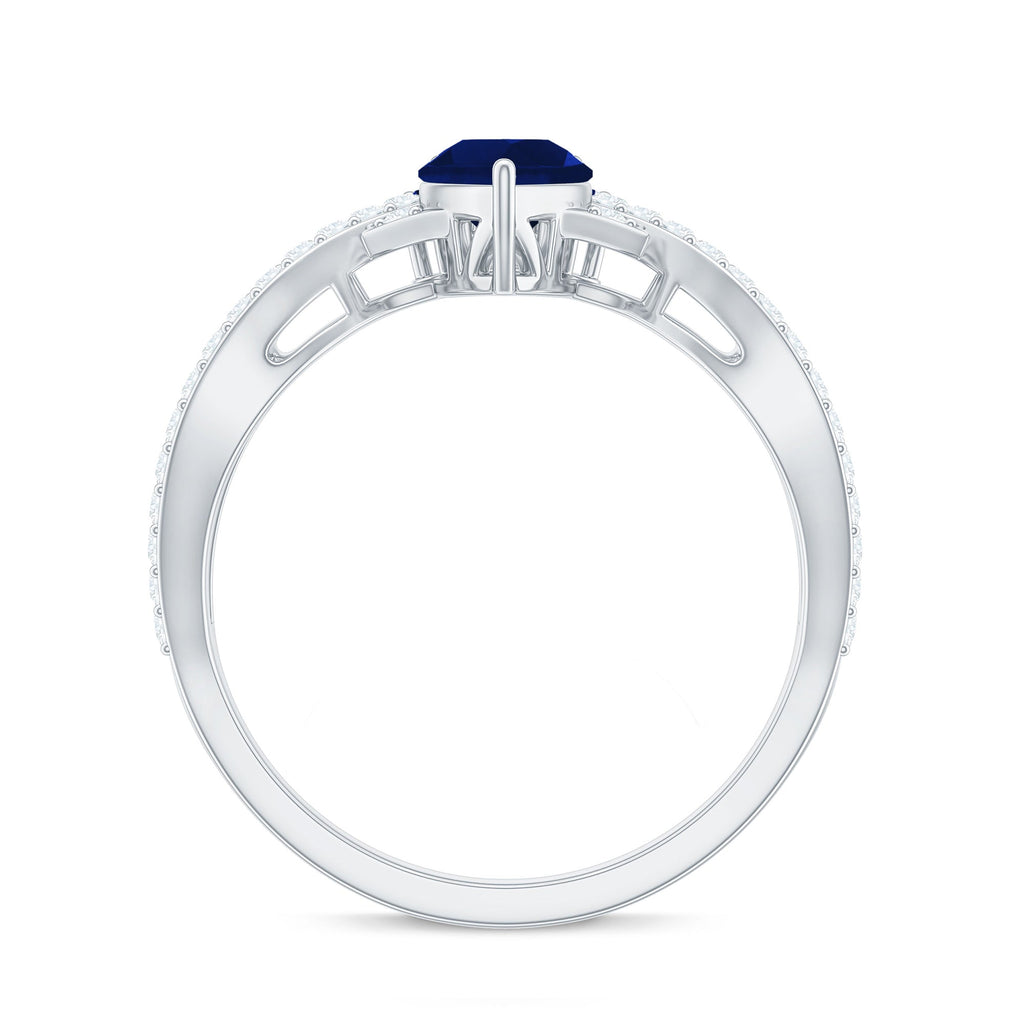 Real 0.5 Blue Sapphire Pear Shape Engagement Ring with Diamond Crossover