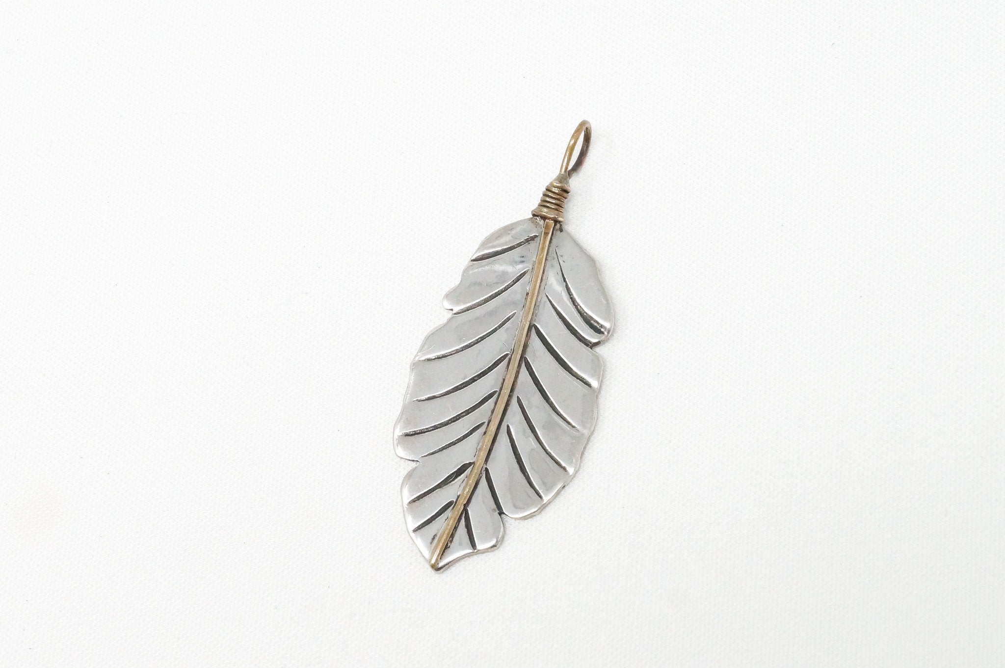 Native American Tobias Brass Feather Handmade Sterling Silver Necklace Pendant | Jewelry > Necklaces > Pendants | Wiccan Center